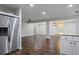 Open living area with hardwood floors leads to the kitchen and dining space at 263 Mountainview Cir, Canton, GA 30115