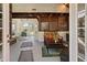 Cozy sunroom with tile floors, a wooden beam ceiling, and patio furniture at 263 Mountainview Cir, Canton, GA 30115