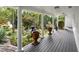 Covered porch overlooking landscaped gardens and a serene fountain at 263 Mountainview Cir, Canton, GA 30115