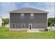 Exterior back of house with a gray siding, white trim and a well-maintained lawn at 342 Orwell Drive Lot 95, Social Circle, GA 30025