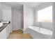 Luxurious bathroom with a freestanding tub, walk-in shower, and stylish vanity, designed for relaxation and comfort at 342 Orwell Drive Lot 95, Social Circle, GA 30025