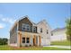 Beautiful two-story home featuring a covered front porch with wood columns and a two-car garage at 342 Orwell Drive Lot 95, Social Circle, GA 30025