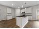 Charming kitchen features a center island, stainless steel appliances, white cabinets, and a bright, airy feel at 342 Orwell Drive Lot 95, Social Circle, GA 30025