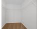Spacious walk-in closet provides ample storage with white wire shelving and neutral carpet at 342 Orwell Drive Lot 95, Social Circle, GA 30025