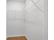 An empty walk-in closet with white walls, a wire shelf system and carpet floors at 342 Orwell Drive Lot 95, Social Circle, GA 30025