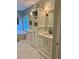 Luxurious bathroom featuring dual vanities, ample storage, and a soaking tub at 5085 Johns Creek Ct, Johns Creek, GA 30022