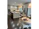 Well-lit kitchen featuring a center island, stainless steel appliances, and a cozy breakfast area at 5085 Johns Creek Ct, Johns Creek, GA 30022