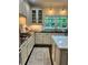 Modern kitchen with granite countertops, stainless steel appliances, and custom cabinets at 5085 Johns Creek Ct, Johns Creek, GA 30022