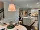 Elegant kitchen with a center island, stainless steel appliances, and an attached dining area at 5085 Johns Creek Ct, Johns Creek, GA 30022