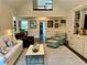 Open-concept living room showcasing hardwood floors and neutral decor at 5085 Johns Creek Ct, Johns Creek, GA 30022