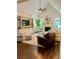 Comfortable living room with high ceilings, a fireplace, and built-in shelving at 5085 Johns Creek Ct, Johns Creek, GA 30022