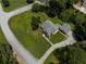 Aerial view of a landscaped property with a circular driveway and mature trees at , Stockbridge, GA 30281