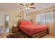 Inviting bedroom with natural light, a modern bed frame and hardwood floors at , Stockbridge, GA 30281