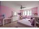Bright bedroom featuring pink walls, white furniture and ceiling fan at , Stockbridge, GA 30281