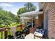 Enjoy the partially covered deck with wood floors, a seating area, and space for container gardening at , Stockbridge, GA 30281