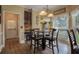 Cozy dining area with a modern chandelier, large window, and stylish decor at , Stockbridge, GA 30281