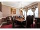 Traditional dining room featuring an ornate light fixture and seating for four at , Stockbridge, GA 30281