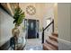 Welcoming foyer boasting a grand front door, staircase, and elegant décor at , Stockbridge, GA 30281
