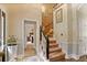 Bright hallway leading to bedroom with carpeted stairs and white trim at , Stockbridge, GA 30281