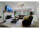 Comfortable living room featuring a fireplace, large TV, and plush seating at , Stockbridge, GA 30281