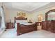 Spacious main bedroom with tray ceiling, decorative furniture, and ensuite bathroom at , Stockbridge, GA 30281