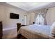 Comfortable main bedroom featuring neutral decor and a large window at , Stockbridge, GA 30281