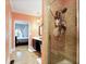 Bathroom shower with decorative tile, shower head, and corner storage shelves at , Stockbridge, GA 30281