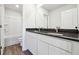 Bathroom featuring a double sink vanity with a dark granite countertop and white cabinets at 358 Orwell Dr, Social Circle, GA 30025