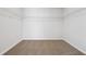 Empty walk-in closet with wire shelving and neutral carpet at 358 Orwell Dr, Social Circle, GA 30025