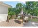 Inviting back deck with comfortable outdoor seating with green trees at 3794 Brown Owl Ct, Marietta, GA 30062
