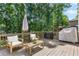 Back deck with outdoor furniture, grill, and smoker is ready for entertaining at 3794 Brown Owl Ct, Marietta, GA 30062