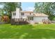 Expansive backyard featuring a well-maintained lawn, mature trees, and a relaxing deck at 3794 Brown Owl Ct, Marietta, GA 30062