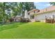 Spacious backyard view featuring a well-maintained lawn and large back deck at 3794 Brown Owl Ct, Marietta, GA 30062