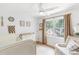 Cozy Bedroom featuring a crib, comfortable chair, and natural light, creating a serene environment at 3794 Brown Owl Ct, Marietta, GA 30062