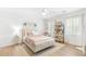 Charming bedroom with soft textures, a stylish bookshelf, and natural light, creating a relaxing atmosphere at 3794 Brown Owl Ct, Marietta, GA 30062