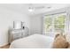 Bright bedroom features a ceiling fan, double window, and a stylish dresser at 3794 Brown Owl Ct, Marietta, GA 30062