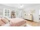 Bright bedroom featuring chic decor, a comfortable bed, and ample closet space, perfect for a serene retreat at 3794 Brown Owl Ct, Marietta, GA 30062