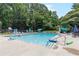 Community pool with several people enjoying the nice blue water on a sunny day at 3794 Brown Owl Ct, Marietta, GA 30062