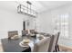 Bright dining area with a dark wood table and seating for six by shuttered windows at 3794 Brown Owl Ct, Marietta, GA 30062