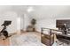 Bright home office with modern decor, wood floors, and an exercise bike, ideal for a healthy work-life balance at 3794 Brown Owl Ct, Marietta, GA 30062