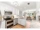 Bright, open kitchen featuring granite countertops and stainless steel appliances at 3794 Brown Owl Ct, Marietta, GA 30062