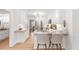 Open kitchen with granite counters, barstool seating, and white cabinets at 3794 Brown Owl Ct, Marietta, GA 30062