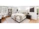 Inviting main bedroom with bright neutral decor, a cozy chair, and natural light at 3794 Brown Owl Ct, Marietta, GA 30062