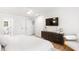 Well-lit main bedroom with a television and access to the bathroom at 3794 Brown Owl Ct, Marietta, GA 30062