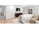 Bright main bedroom featuring a TV, soft textures, and an attached closet at 3794 Brown Owl Ct, Marietta, GA 30062