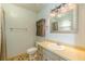 Cozy bathroom features a vanity, toilet, and decorative storage, ideal for a starter home at 800 Greenwood Se Trl, Conyers, GA 30094