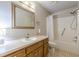 Functional bathroom with oak cabinets, bathtub, shower and neutral wall paint at 800 Greenwood Se Trl, Conyers, GA 30094