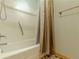 The bathroom has a nice bathtub, shower and curtain with neutral wall paint at 800 Greenwood Se Trl, Conyers, GA 30094