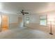 Bedroom with ceiling fan, natural light, and access to a bathroom at 800 Greenwood Se Trl, Conyers, GA 30094