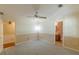 Cozy bedroom with a ceiling fan, neutral colored carpet and two toned wall paint at 800 Greenwood Se Trl, Conyers, GA 30094
